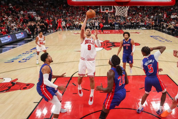 Chicago Bulls center Nikola Vucevic (9) goes up for a shot during the second half of the home opener against the Detroit Pistons at the United Center Wednesday Oct. 22, 2025 in Chicago. (Armando L. Sanchez/Chicago Tribune)