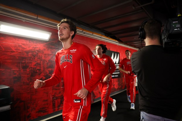 Chicago Bulls forward Matas Buzelis (14) runs to the court before playing the Minnesota Timberwolves at the United Center Thursday Oct. 16, 2025, in Chicago. (Armando L. Sanchez/Chicago Tribune)