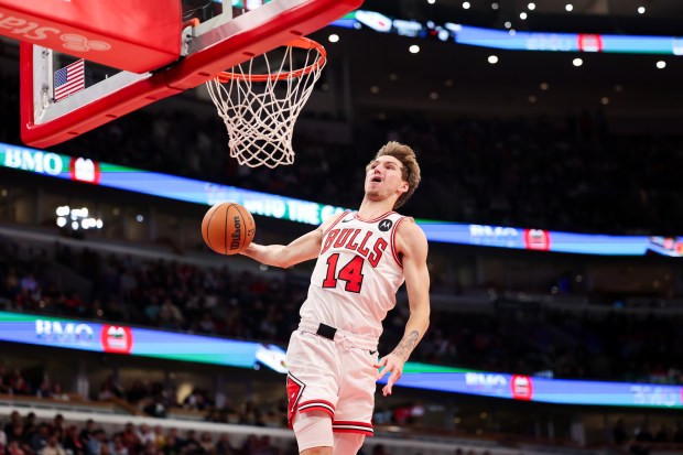 Chicago Bulls forward Matas Buzelis (14) goes up for a dunk during the third quarter against the Minnesota Timberwolves at the United Center Thursday Oct. 16, 2025, in Chicago. (Armando L. Sanchez/Chicago Tribune)