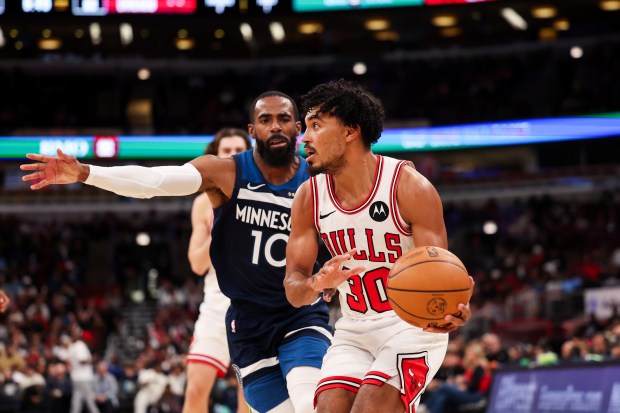 Minnesota Timberwolves guard Mike Conley (10) guards Chicago Bulls guard Tre Jones (30) during the third quarter at the United Center Thursday Oct. 16, 2025, in Chicago. (Armando L. Sanchez/Chicago Tribune)