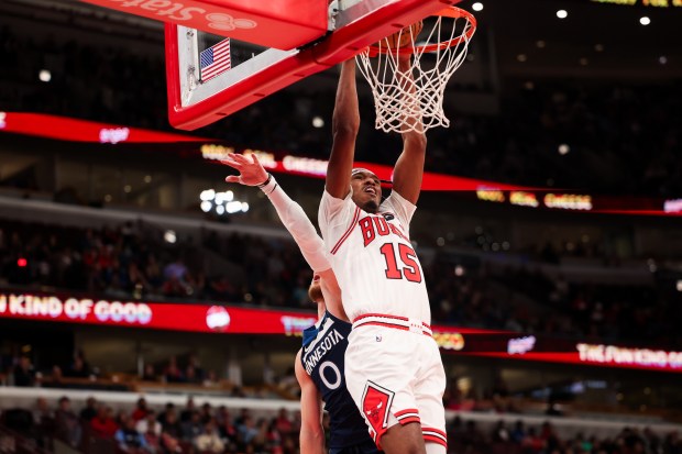 Chicago Bulls forward Julian Phillips (15) dunks the ball during the third quarter against the Minnesota Timberwolves at the United Center Thursday Oct. 16, 2025, in Chicago. (Armando L. Sanchez/Chicago Tribune)