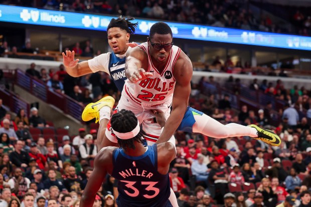 Minnesota Timberwolves guard Johnny Juzang (33) fouls Chicago Bulls forward Jalen Smith (25) during the fourth quarter at the United Center Thursday Oct. 16, 2025, in Chicago. (Armando L. Sanchez/Chicago Tribune)