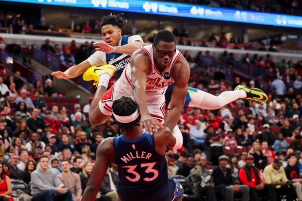 Minnesota Timberwolves guard Johnny Juzang (33) fouls Chicago Bulls forward Jalen Smith (25) during the fourth quarter at the United Center Thursday Oct. 16, 2025, in Chicago. (Armando L. Sanchez/Chicago Tribune)