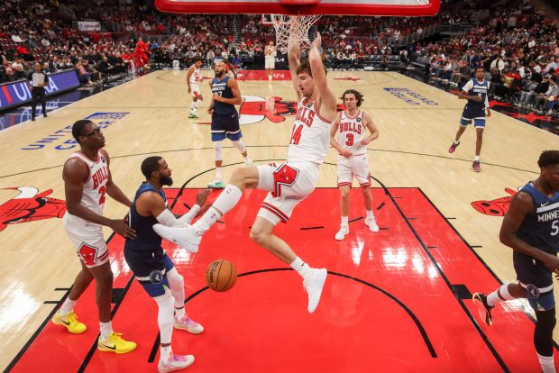 Chicago Bulls forward Matas Buzelis (14) dunks the ball during the first half against the Minnesota Timberwolves at the United Center Thursday Oct. 16, 2025, in Chicago. (Armando L. Sanchez/Chicago Tribune)