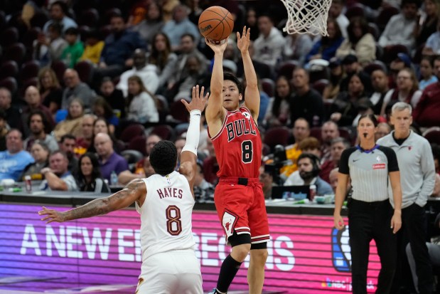Bulls guard Yuki Kawamura, right, shoots over Cavaliers guard Killian Hayes during a preseason game Tuesday, Oct. 7, 2025, in Cleveland. (Sue Ogrocki/AP)