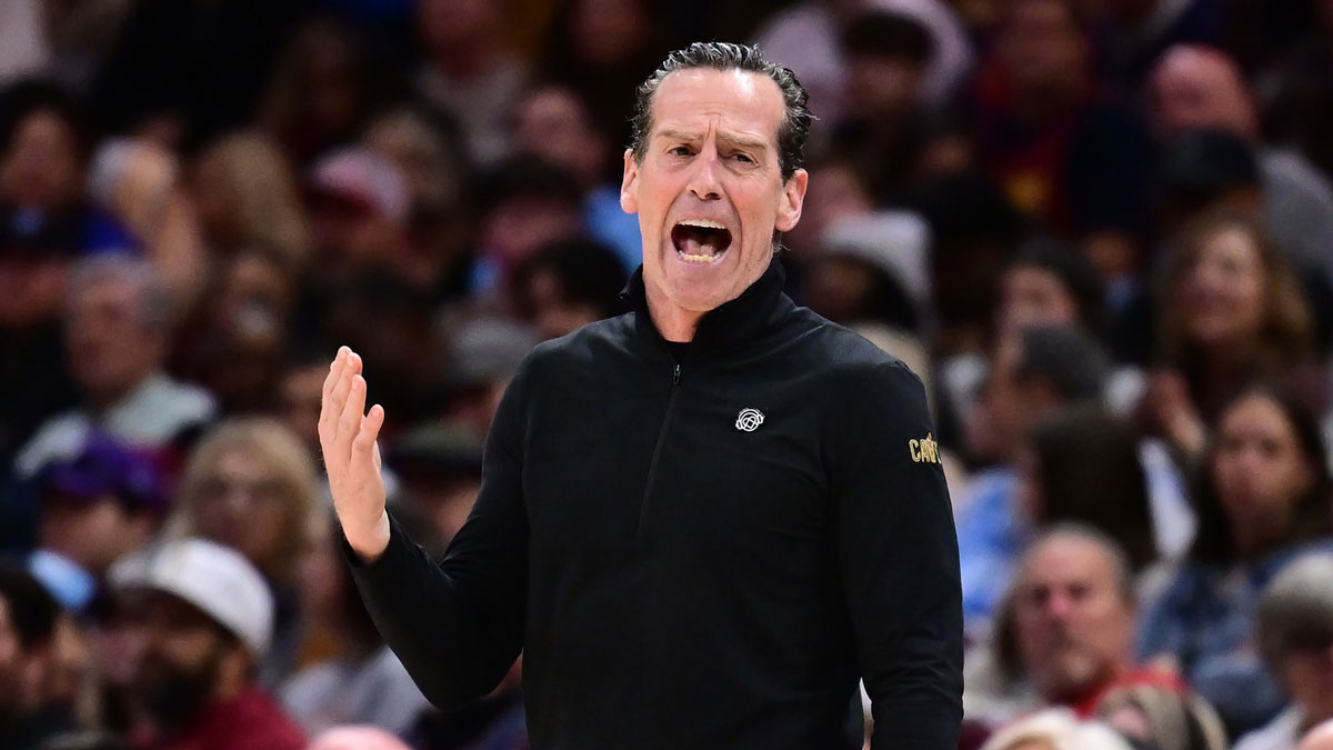 Cavaliers head coach Kenny Atkinson reacts during the second half against the Sacramento Kings at Rocket Arena with Cavs regular season in the background