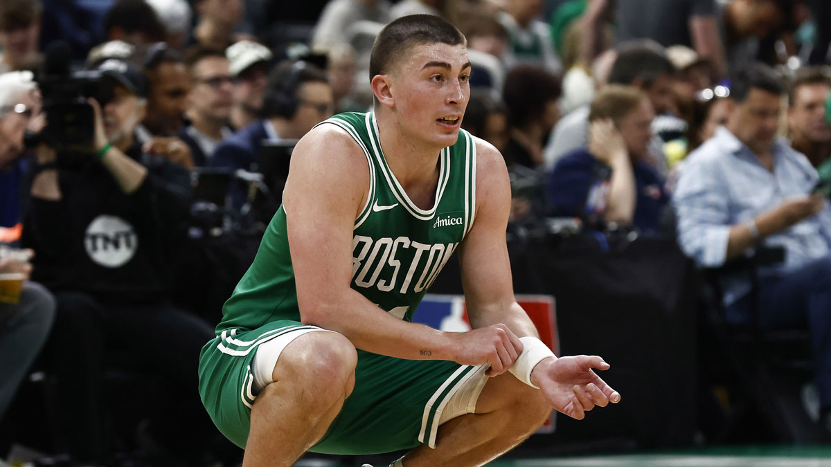 Celtics guard Payton Pritchard (11) looks on during the second quarter of game two of the first round of the 2024 NBA Playoffs against the Orlando Magic at TD Garden with Jrue Holiday in the background