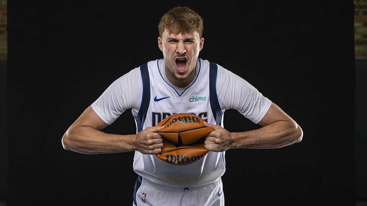 Dallas Mavericks forward Cooper Flagg (32) poses for a photo during the Mavericks 2025 media day at the American Airlines Center.