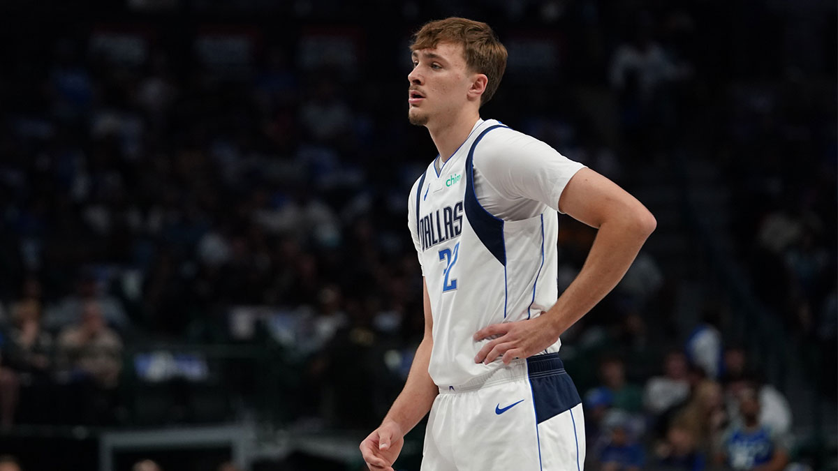 Dallas Mavericks forward Cooper Flagg (32) stands on the court against the Charlotte Hornets in the first half of a game at American Airlines Center.