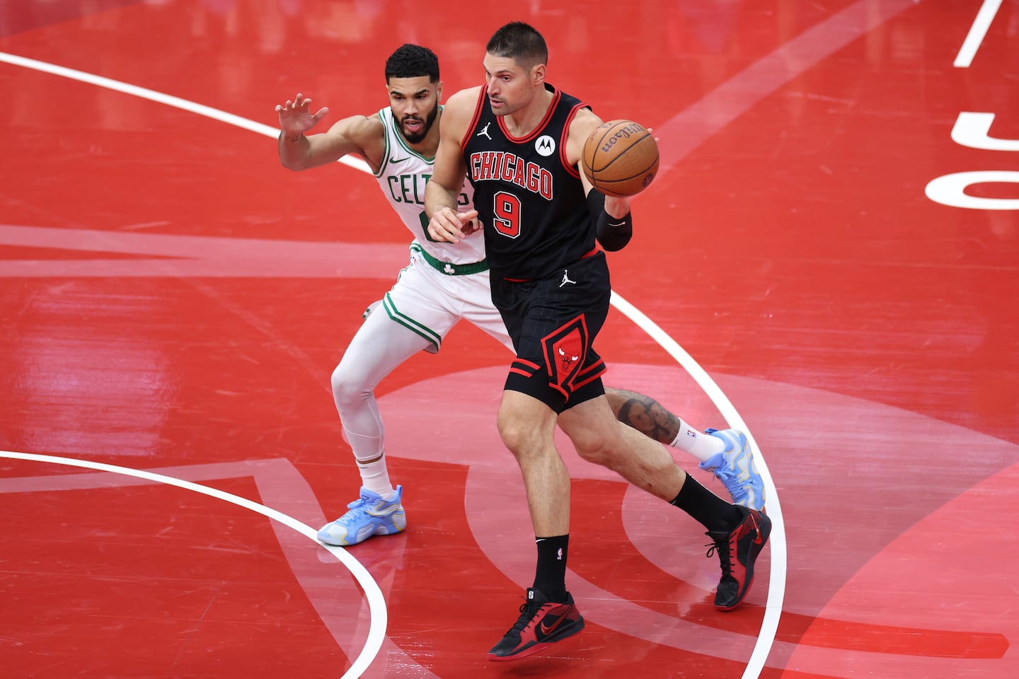 Nikola Vucevic (No. 9) hit 6 of 9 shots from 3-point range to test Jayson Tatum and the Celtics in Friday night's NBA Cup matchup in Chicago.