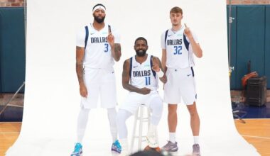 Dallas Mavericks forward Cooper Flagg (32), guard Kyrie Irving (11) and forward Anthony Davis (3) pose for a photo during the NBA basketball team's media day in Dallas, Monday, Sept. 29, 2025. (AP Photo/LM Otero)