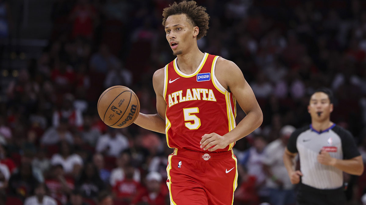 Atlanta Hawks guard Dyson Daniels (5) dribbles the ball during the third quarter against the Houston Rockets at Toyota Center