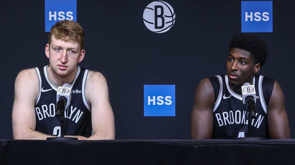 Brooklyn Nets forward Danny Wolf (2) and guard Drake Powell (4) speak at Media Day.