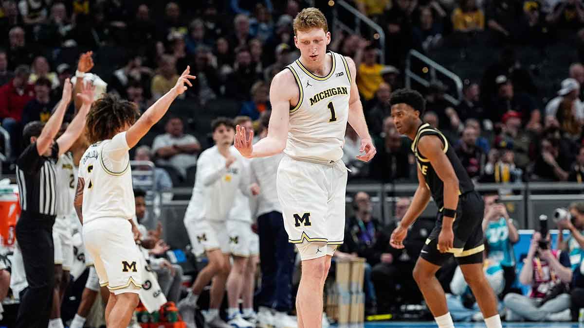 Michigan center Danny Wolf celebrates a 3-point basket against Purdue during the second half of a Big Ten Tournament quarterfinal at Gainbridge Fieldhouse in Indianapolis on Friday, March 14, 2025.