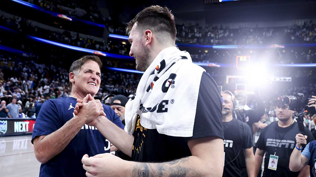 Los Angeles Lakers guard Luka Doncic (77) hugs Mark Cuban after the game against the Dallas Mavericks at American Airlines Center.