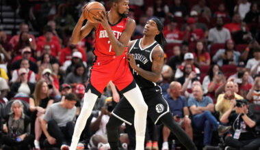 Houston Rockets forward Kevin Durant (7) controls the ball against Brooklyn Nets guard Terance Mann, right, during the first half of an NBA basketball game, Monday, Oct. 27, 2025, in Houston. (AP Photo/Karen Warren)