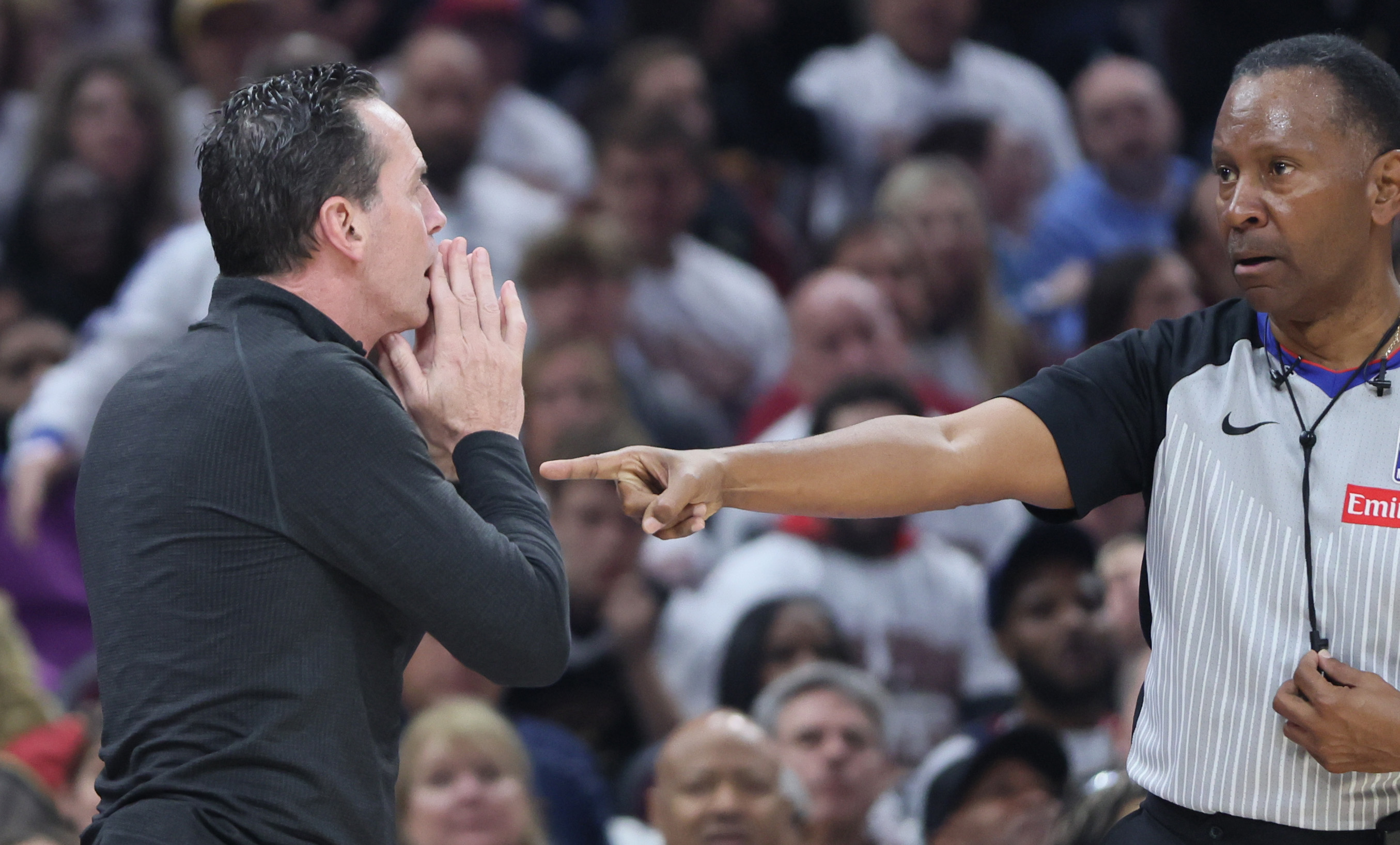 Cleveland Cavaliers head coach Kenny Atkinson pleads with official James Capers after a foul call in the first half at Rocket Arena. 