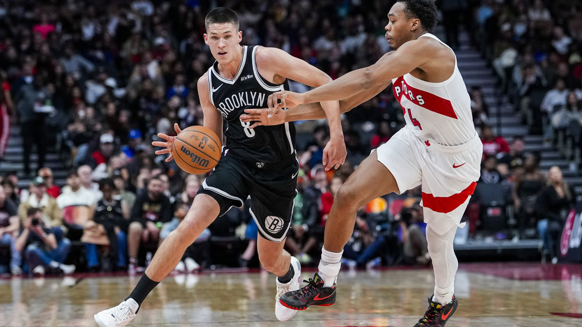 Oct 17, 2025; Toronto, Ontario, CAN; Brooklyn Nets guard Egor Dëmin (8) dribbles the ball against Toronto Raptors forward/guard Scottie Barnes (4) during the second quarter at Scotiabank Arena. Mandatory Credit: Kevin Sousa-Imagn Images