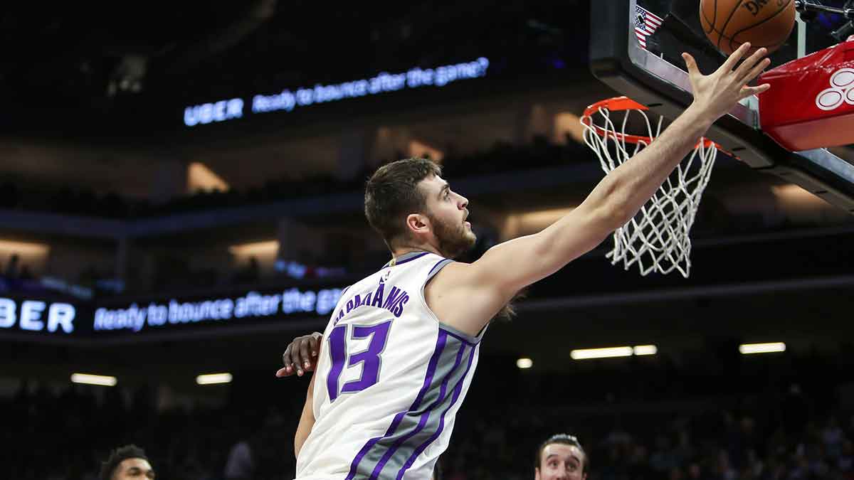 Sacramento Kings center Georgios Papagiannis (13) reaches for a rebound against the Charlotte Hornets during the second half at Golden 1 Center.