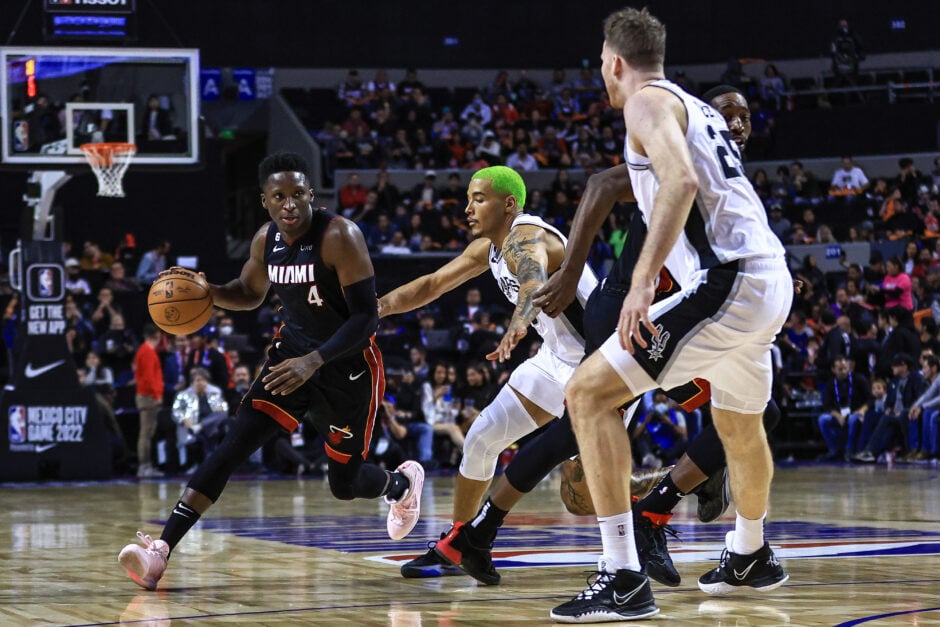 Victor Oladipo #4 of the Miami Heat dribbles the ball against Jeremy Sochan #10 of the San Antonio Spurs during the game between San Antonio Spurs against Miami Heat at Arena Ciudad de Mexico on December 17, 2022 in Mexico City, Mexico. NOTE TO USER: User expressly acknowledges and agrees that, by downloading and or using this photograph, User is consenting to the terms and conditions of the Getty Images License Agreement.