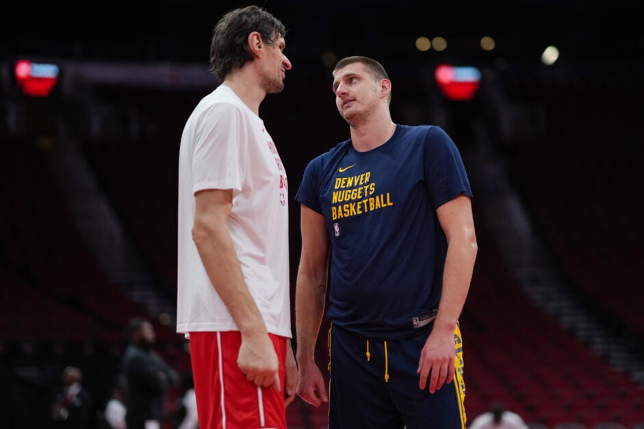 Boban Marjanovic #51 of the Houston Rockets and Nikola Jokic #15 of the Denver Nuggets look on during warmups prior to an NBA In-Season Tournament game at Toyota Center on November 24, 2023 in Houston, Texas.