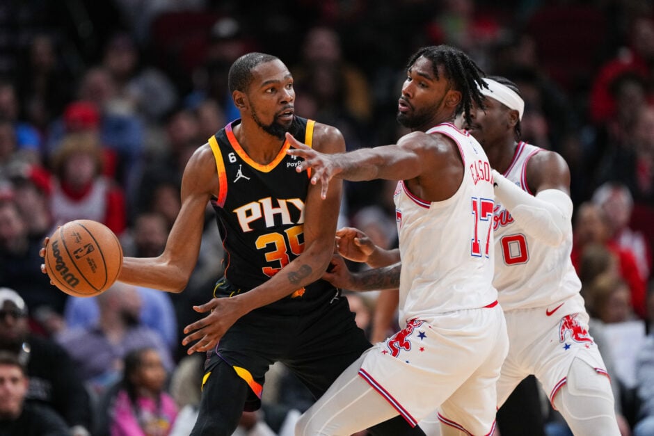 Kevin Durant #35 of the Phoenix Suns dribbles the ball as Tari Eason #17 of the Houston Rockets defends during the third quarter of the game at Toyota Center on December 27, 2023 in Houston, Texas.