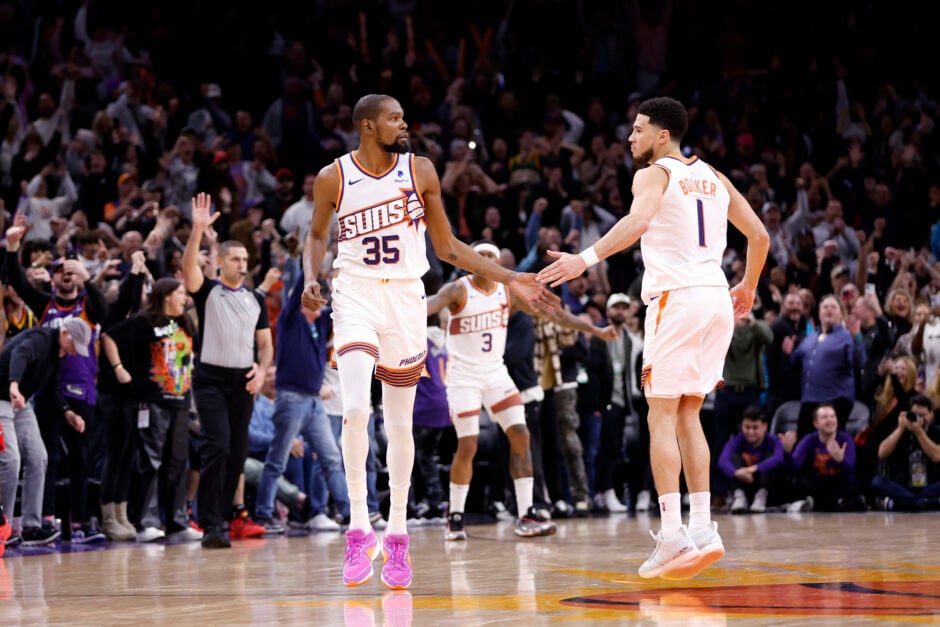 Kevin Durant #35 of the Phoenix Suns celebrates with Devin Booker #1