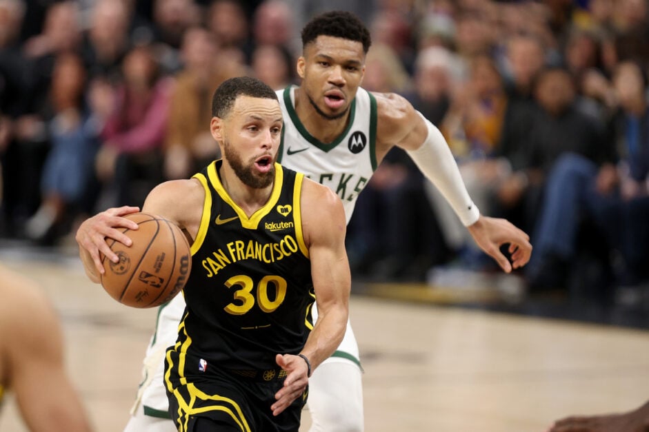 Stephen Curry #30 of the Golden State Warriors dribbles past Giannis Antetokounmpo #34 of the Milwaukee Bucks in the second half at Chase Center.