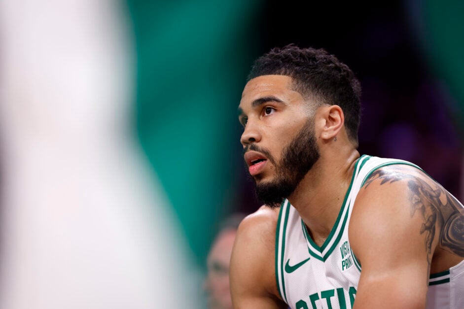 Jayson Tatum #0 of the Boston Celtics sits on the bench during the game against the Phoenix Suns at Footprint Center.