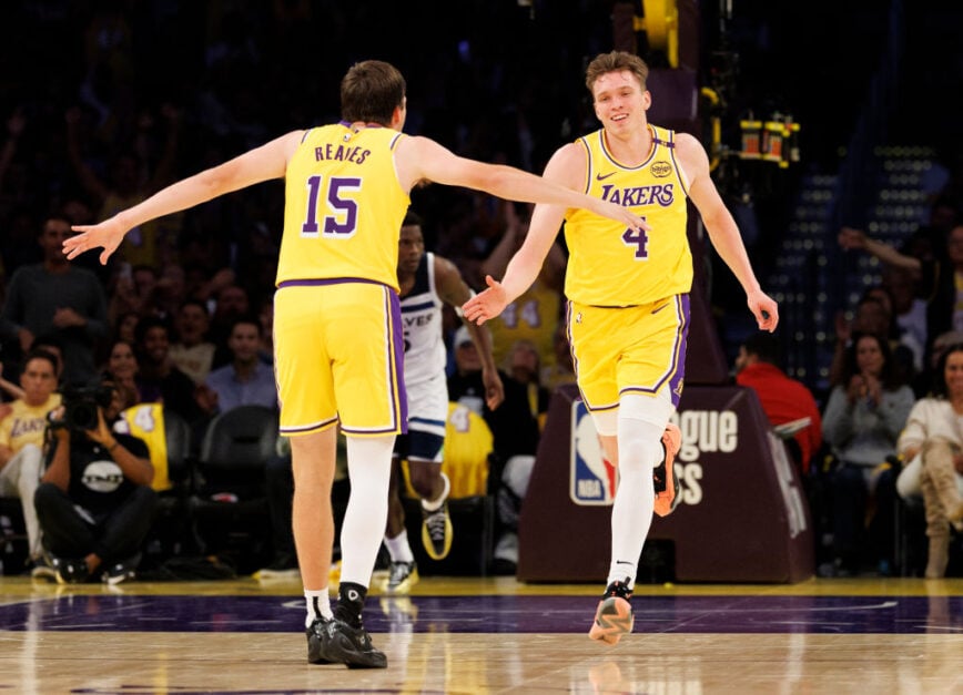 Los Angeles Lakers guard Dalton Knecht (4) reacts with Los Angeles Lakers guard Austin Reaves (15) after scoring against the Minnesota Timberwolves at Crypto.com Arena on October 22, 2024 in Los Angeles, California.