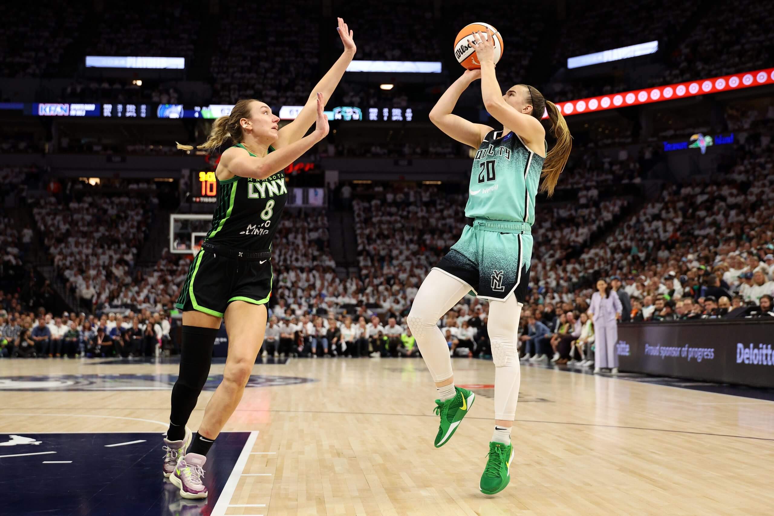 Minnesota's Alanna Smith defends a shot by New York's Sabrina Ionescu.