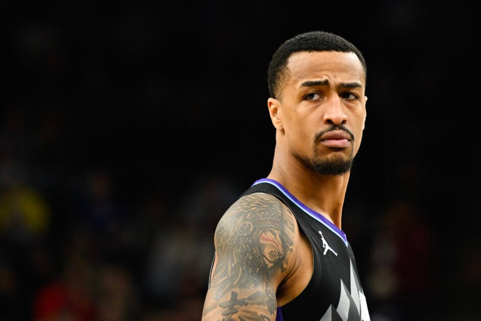 John Collins #20 of the Utah Jazz looks on during the first half of a game against the Minnesota Timberwolves at Delta Center.