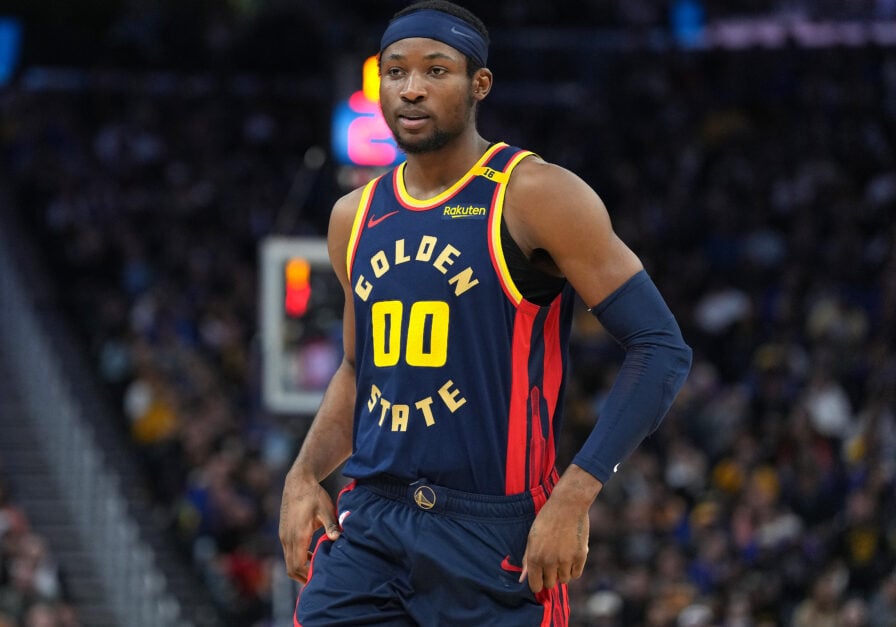 Jonathan Kuminga #00 of the Golden State Warriors looks on against the Sacramento Kings during the third quarter of an NBA basketball game at Chase Center.