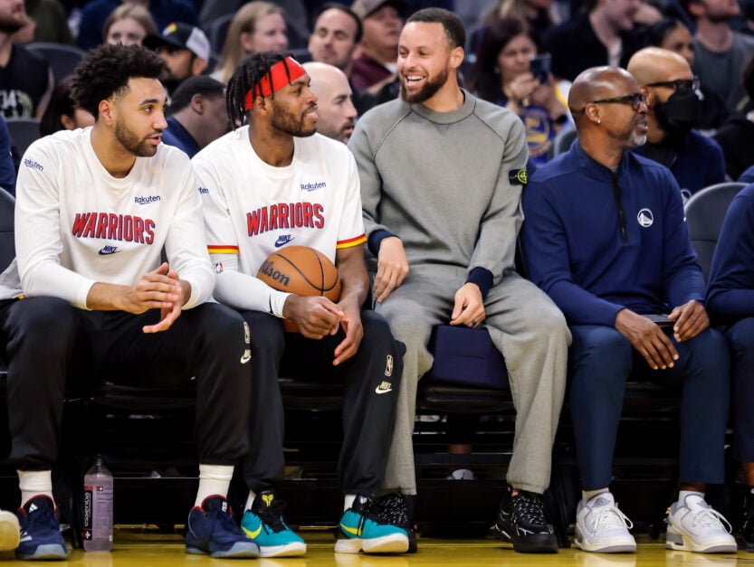 Stephen Curry and Buddy Hield talk during the Warriors games.
