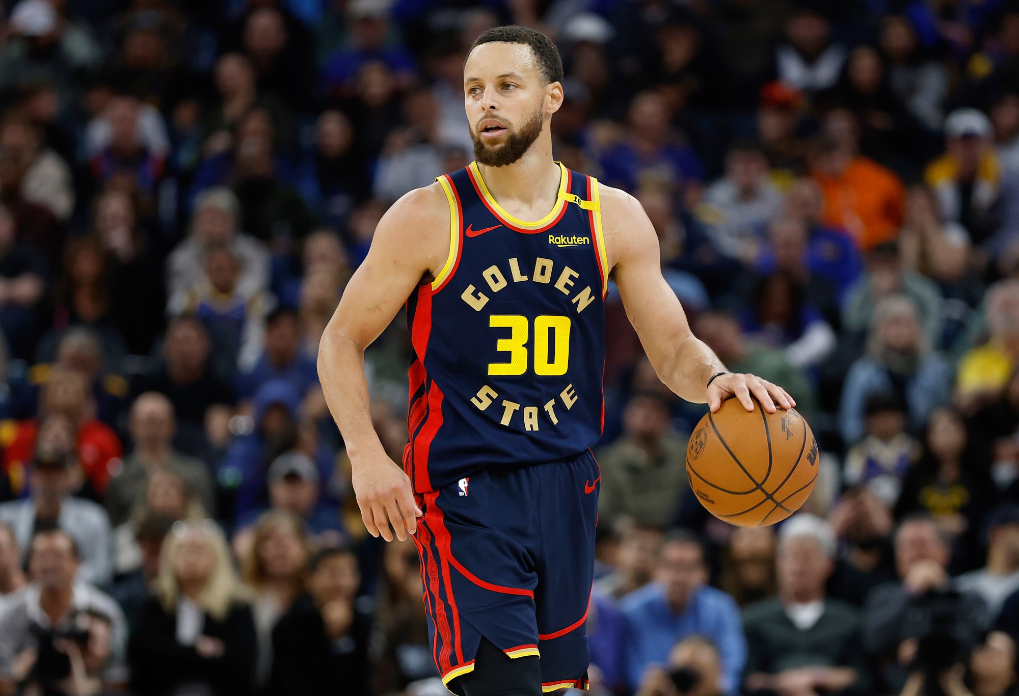 SAN FRANCISCO, CALIFORNIA - MARCH 15: Stephen Curry #30 of the Golden State Warriors dribbles the ball up court against the New York Knicks during the second half of an NBA basketball game at Chase Center on March 15, 2025 in San Francisco, California. NOTE TO USER: User expressly acknowledges and agrees that, by downloading and or using this photograph, User is consenting to the terms and conditions of the Getty Images License Agreement. (Photo by Thearon W. Henderson/Getty Images)