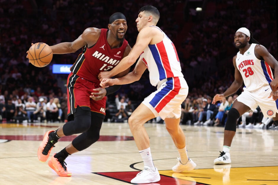 Bam Adebayo #13 of the Miami Heat drives against Simone Fontecchio #19 of the Detroit Pistons during the fourth quarter of the game at Kaseya Center on March 19, 2025 in Miami, Florida.