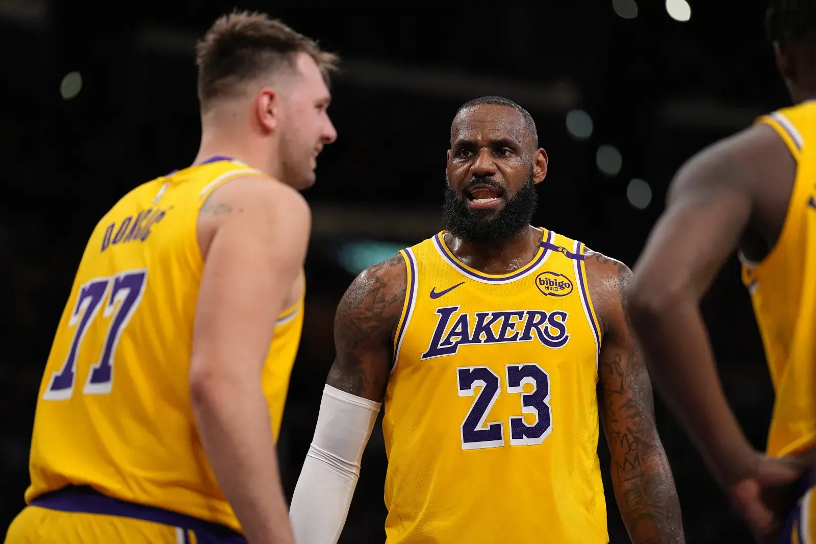 LeBron James #23 of the Los Angeles Lakers reacts to his teammate Luka Doncic