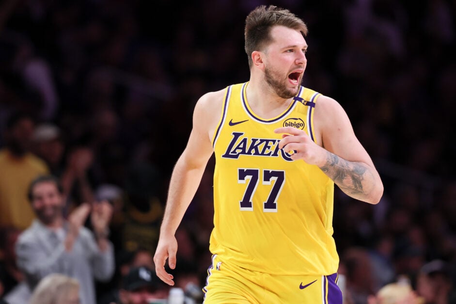 Los Angeles Lakers guard Luka Doncic (77) reacts while running down the court after making a shot during the first quarter of an NBA playoff game against the Minnesota Timberwolves at Crypto.com Arena.