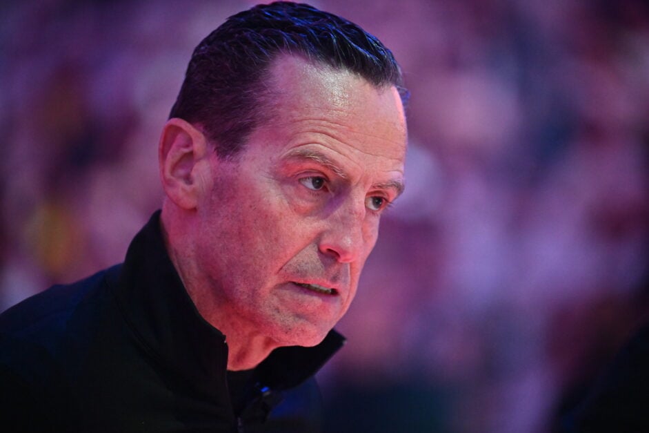 Head coach Kenny Atkinson of the Cleveland Cavaliers listens to the national anthem before game two of the first round of the Eastern Conference Playoffs against the Miami Heat at Rocket Arena.
