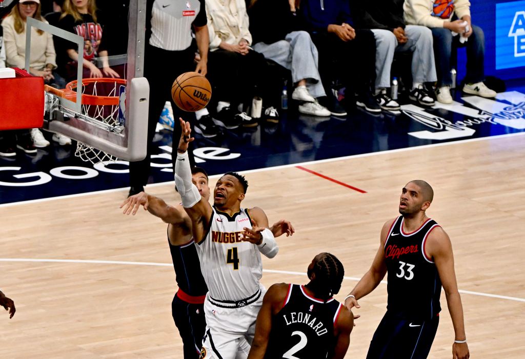 Russell Westbrook #4 of the Denver Nuggets drives to the basket against Kawhi Leonard #2 of the LA Clippers during a playoff game on May 1, 2025.