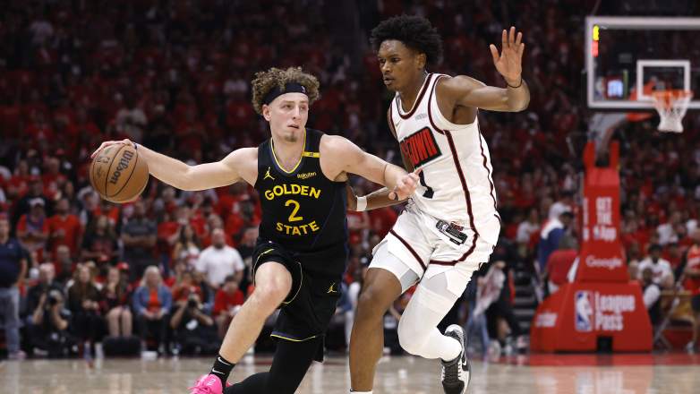 Golden State Warriors guard Brandin Podziemski defended by Houston Rockets guard Amen Thompson