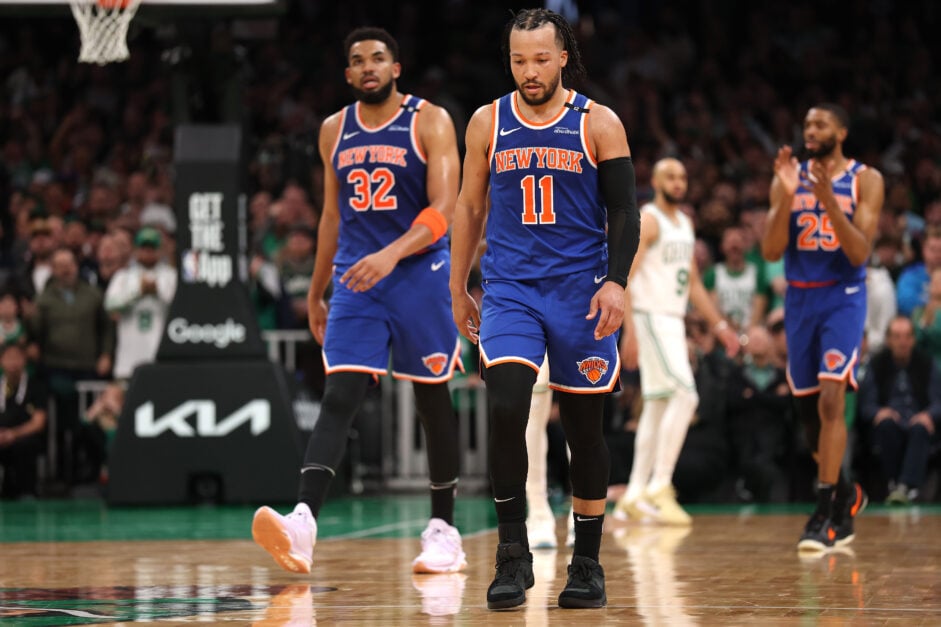 Jalen Brunson #11, Karl-Anthony Towns #32, and Mikal Bridges #25 of the New York Knicks walk down court against the Boston Celtics during the fourth quarter in Game One of the Eastern Conference Second Round.