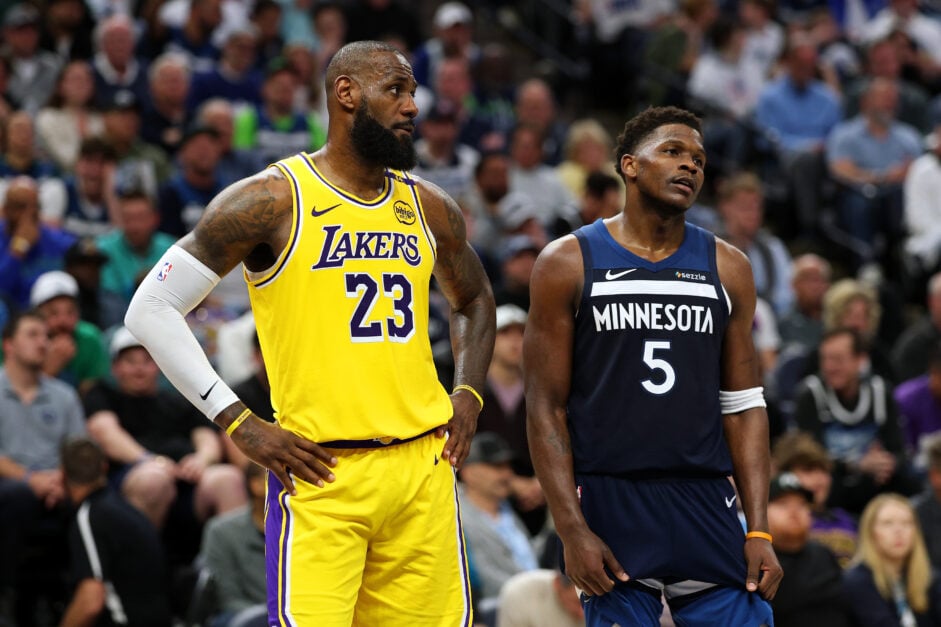 LeBron James #23 of the Los Angeles Lakers and Anthony Edwards #5 of the Minnesota Timberwolves look on in the third quarter of Game Three of the First Round of the 2025 NBA Playoffs.