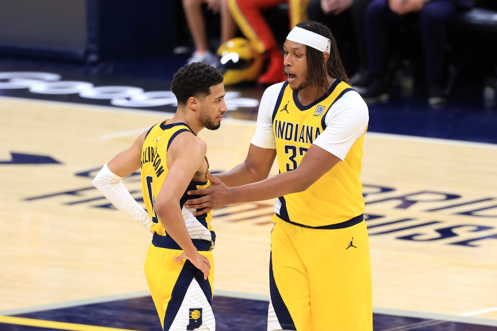 INDIANAPOLIS, INDIANA - MAY 25: Myles Turner #33 of the Indiana Pacers talks with Tyrese Haliburton #0 during the third quarter against the New York Knicks in Game Three of the Eastern Conference Finals of the 2025 NBA Playoffs at Gainbridge Fieldhouse on May 25, 2025 in Indianapolis, Indiana. 