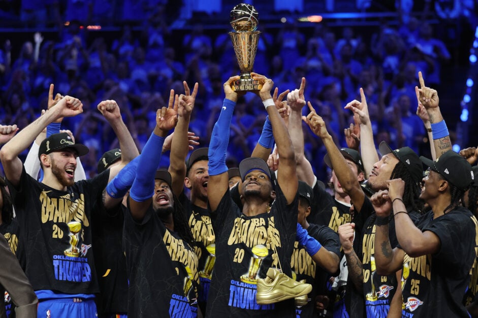Shai Gilgeous-Alexander #2 of the Oklahoma City Thunder celebrates with the Bill Russell NBA Finals Most Valuable Player trophy after defeating the Indiana Pacers 103-91 in Game Seven of the 2025 NBA Finals.