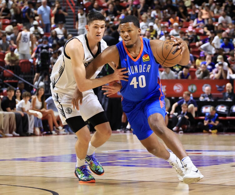 Chris Youngblood #40 of the Oklahoma City Thunder drives against Egor Demin #8 of the Brooklyn Nets in the first half of a 2025 NBA Summer League game