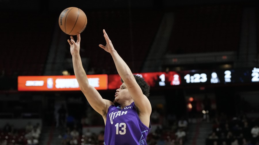 Walt Clayton Jr. #13 of the Utah Jazz shoots...
