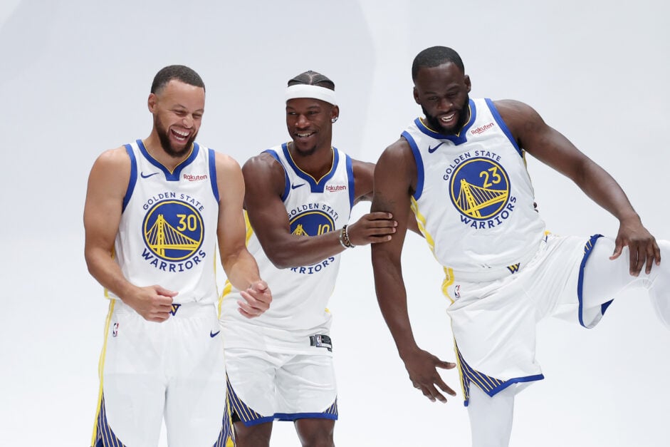 Jimmy Butler III #10, Stephen Curry #30, and Draymond Green #23 of the Golden State Warriors joke around during the Golden State Warriors' media day at Chase Center.