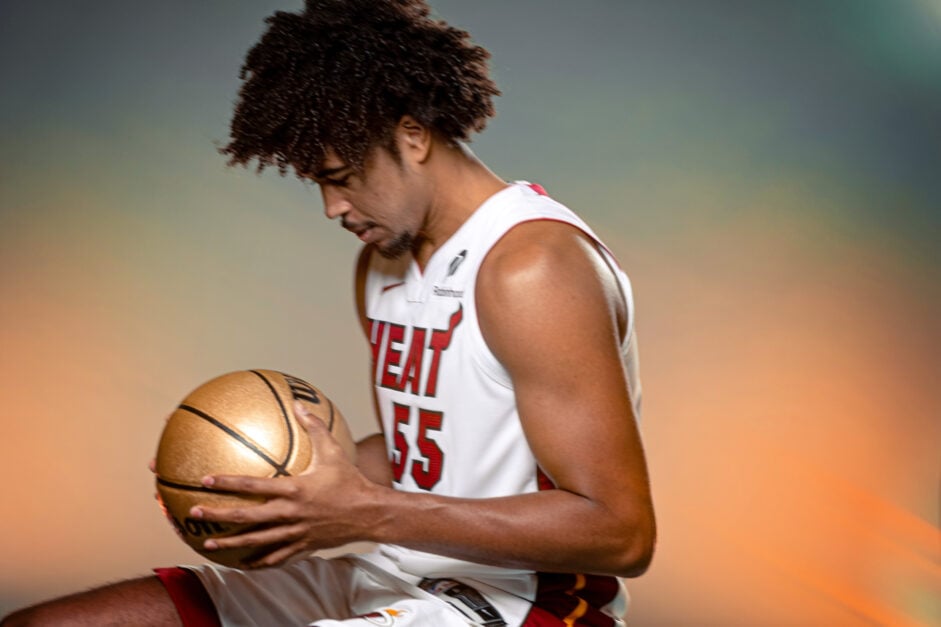 Ethan Thompson holds a basketball at Miami Heat Media Day