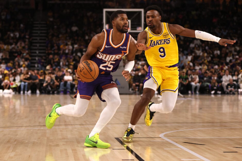 Jared Butler #25 of the Phoenix Suns drives around Bronny James #9 of the Los Angeles Lakers